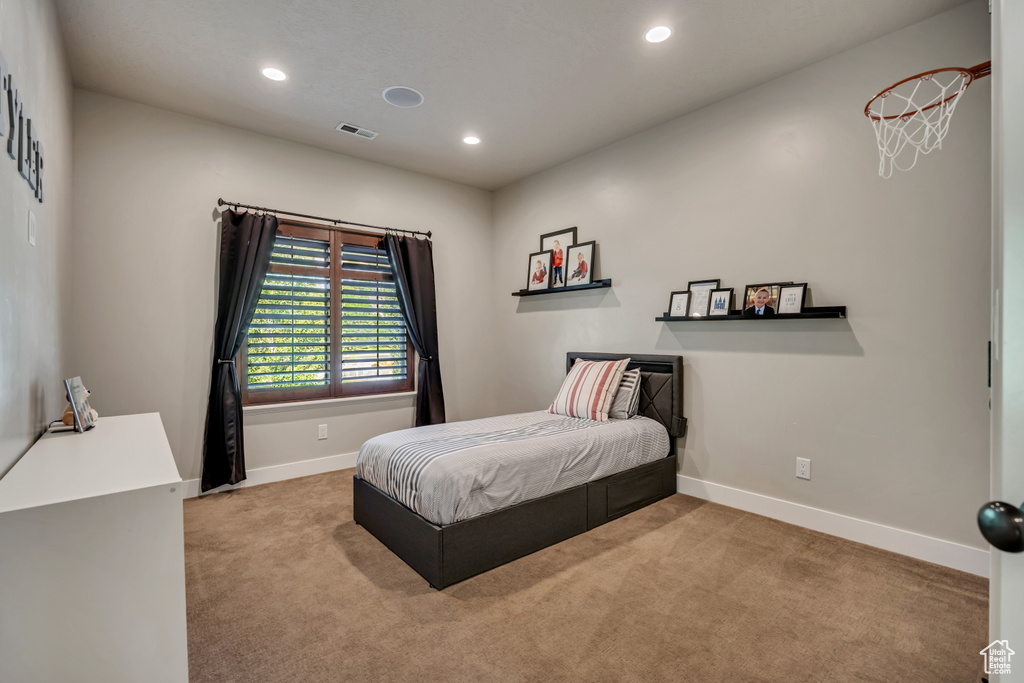 Carpeted bedroom featuring recessed lighting