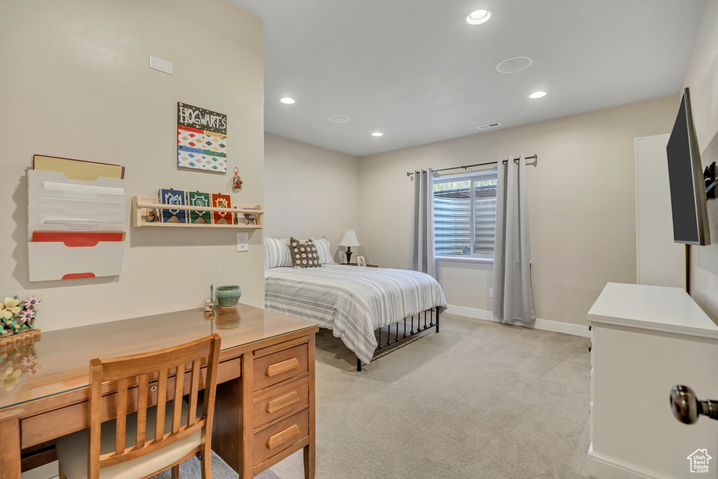 Bedroom with light carpet and recessed lighting