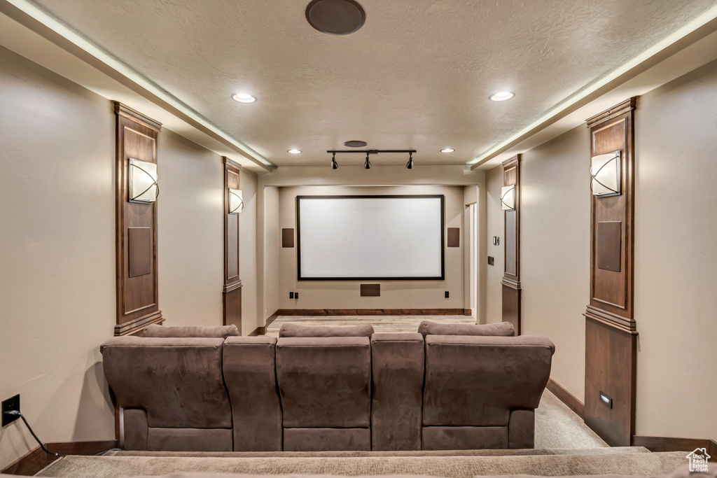 Cinema with a textured ceiling and recessed lighting