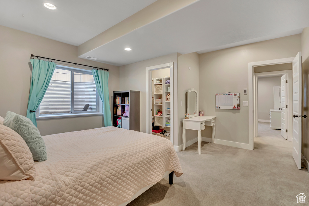 Bedroom with light carpet and recessed lighting