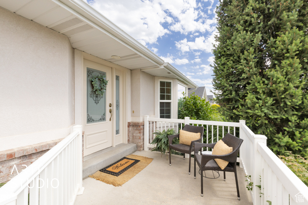 Property entrance featuring stucco siding