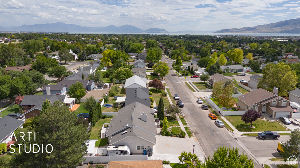 Aerial perspective of suburban area with a mountainous background