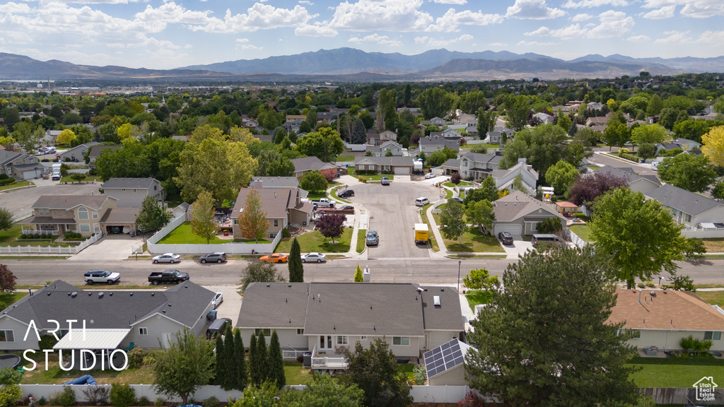 Aerial perspective of suburban area featuring a mountain backdrop