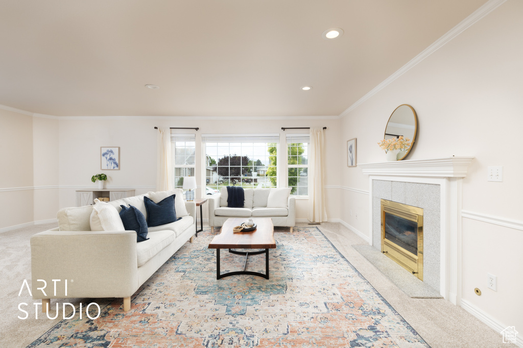 Living area featuring carpet, crown molding, a fireplace, and recessed lighting