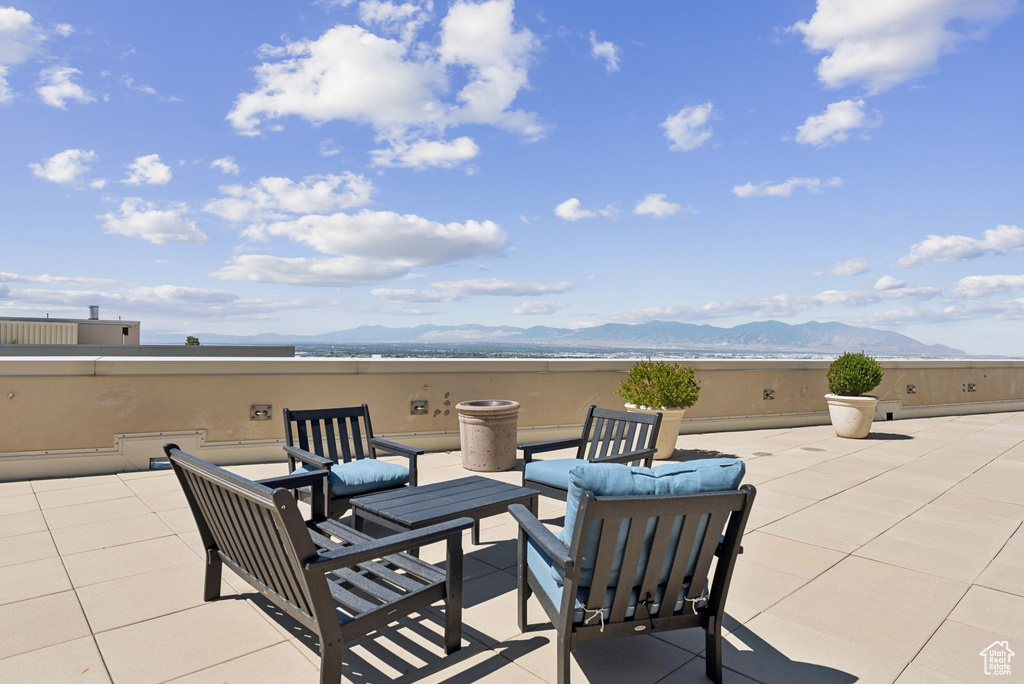 View of patio featuring a mountain view and an outdoor hangout area