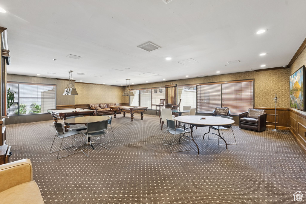Carpeted dining space with billiards table, a wainscoted wall, wallpapered walls, recessed lighting, and wood walls