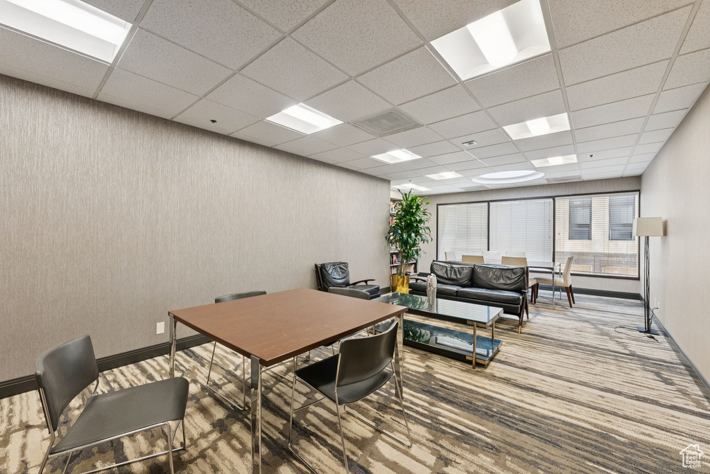 Office space featuring a paneled ceiling and carpet floors