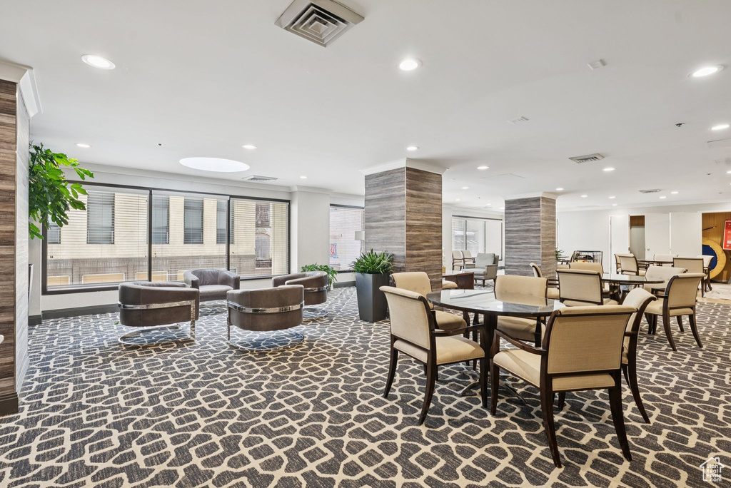 Common area with recessed lighting and ornamental molding