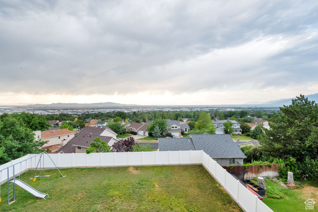 Aerial perspective of suburban area featuring a mountainous background