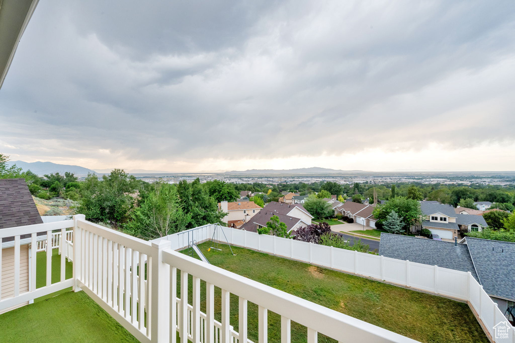Balcony featuring a mountain view and a residential view