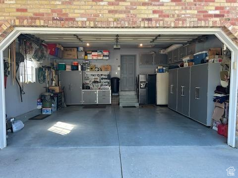 Garage featuring concrete driveway