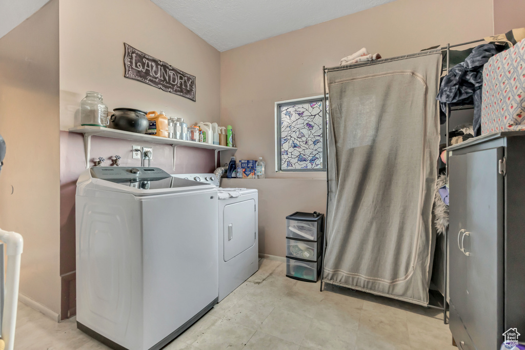Laundry area featuring washing machine and clothes dryer