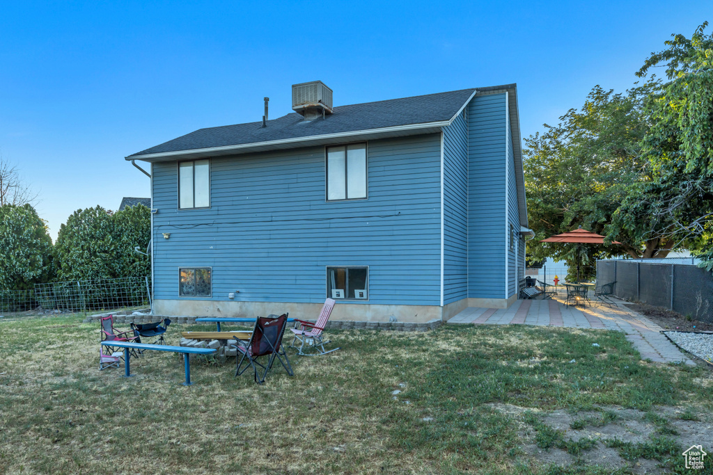 Back of house with a patio