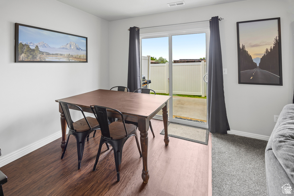 Dining room featuring baseboards and wood finished floors