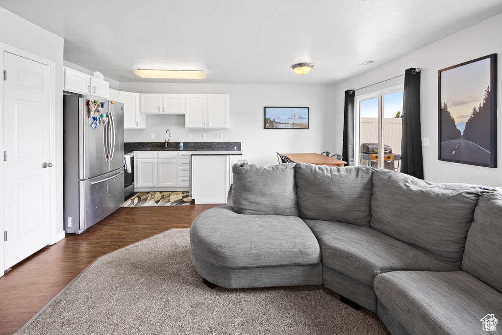 Living area featuring dark wood-style floors