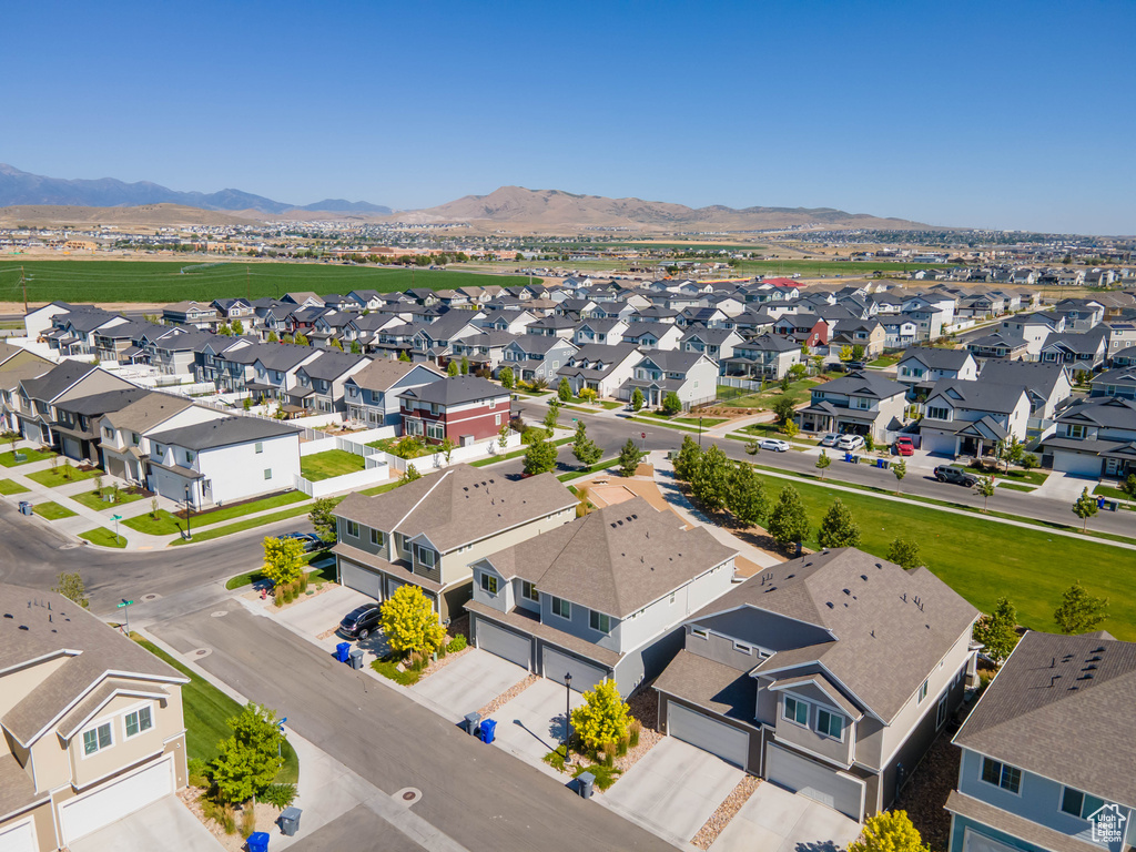 Aerial view of residential area featuring a mountain backdrop