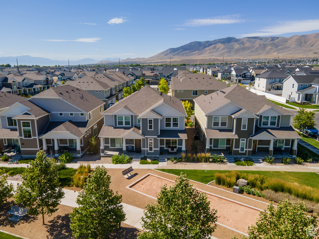 Aerial view of residential area featuring a mountainous background