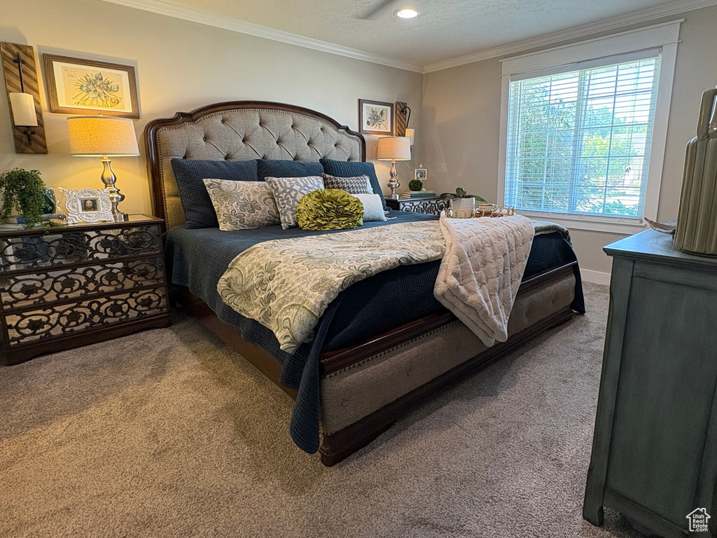 Bedroom featuring carpet flooring, ornamental molding, and recessed lighting