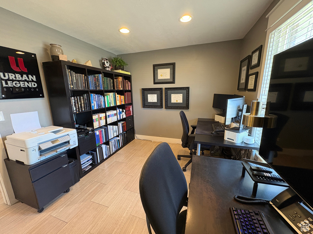 Office space featuring wood finished floors and recessed lighting