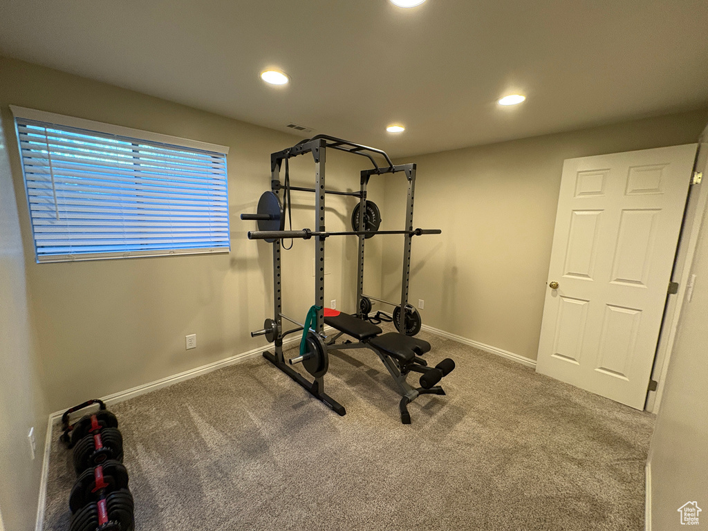 Exercise room with carpet and recessed lighting