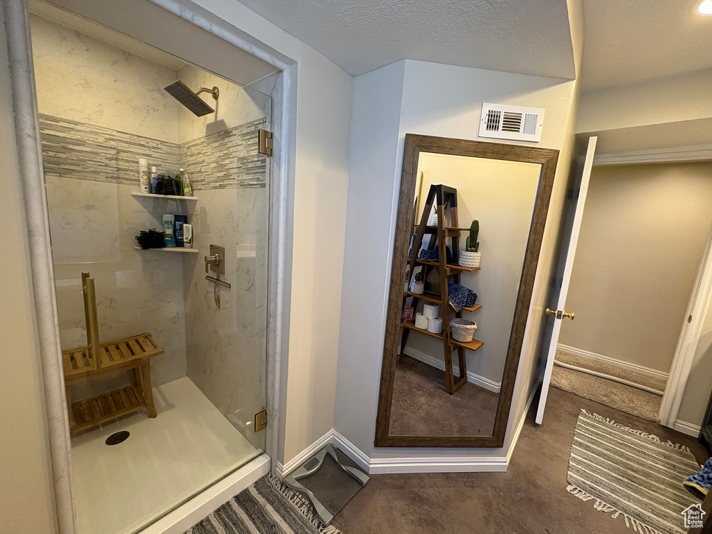 Full bathroom featuring a stall shower