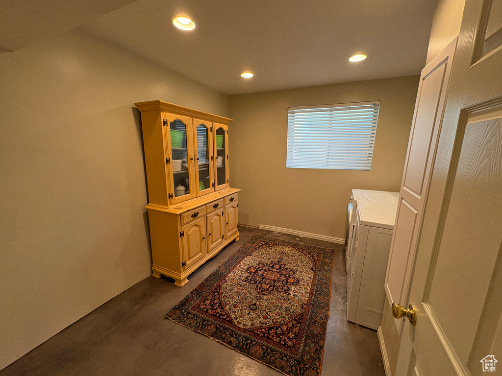 Laundry room with washer and clothes dryer and recessed lighting