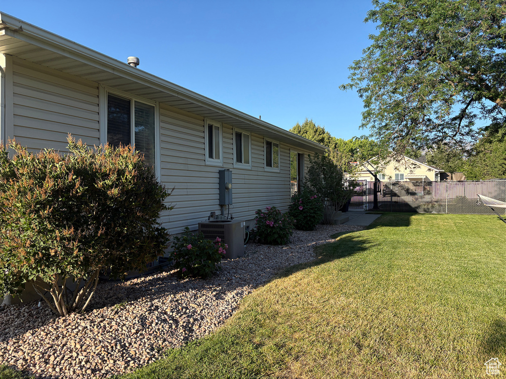 View of property exterior featuring a central AC unit