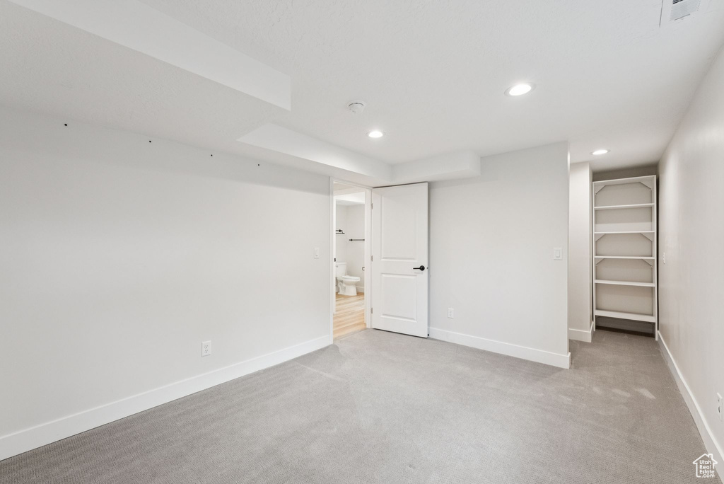 Finished basement featuring recessed lighting and light colored carpet