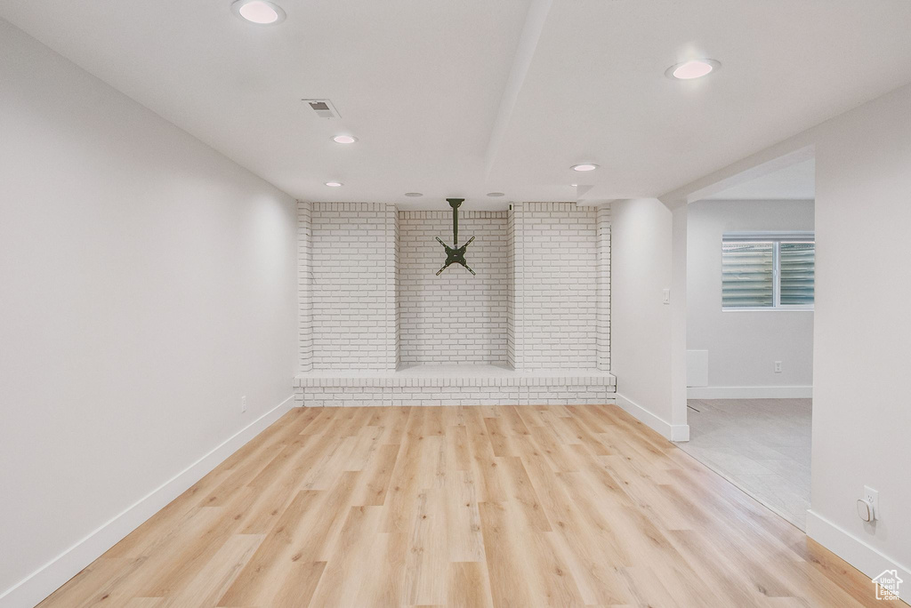 Unfurnished living room with recessed lighting and light wood finished floors