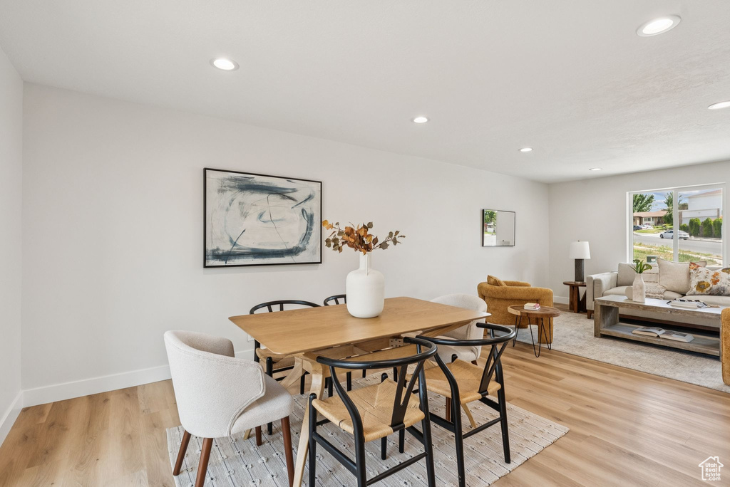 Dining area featuring recessed lighting and light wood-style flooring