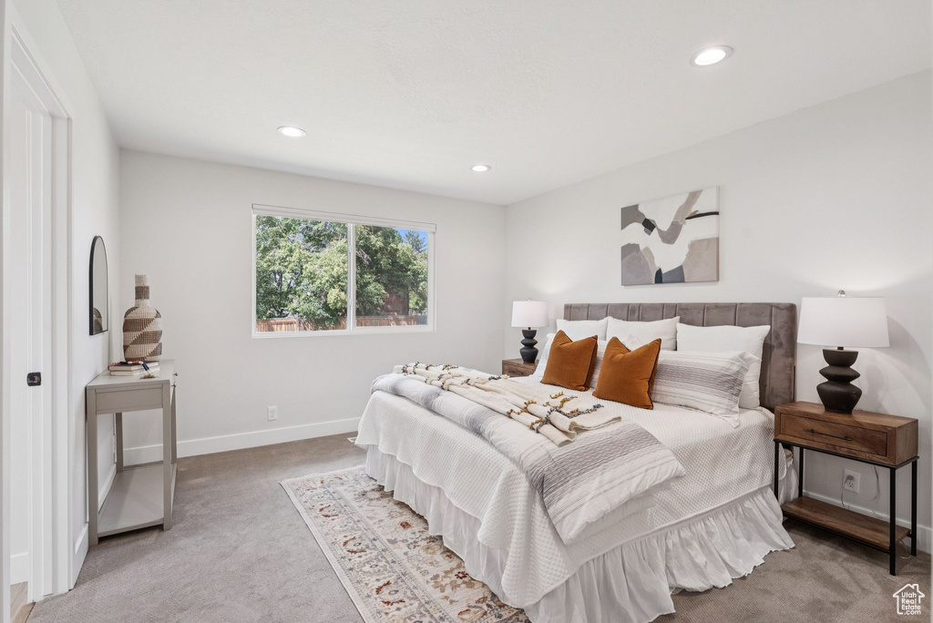 Bedroom with carpet floors and recessed lighting