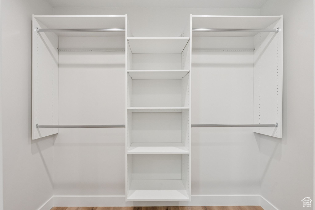 Spacious closet featuring wood finished floors