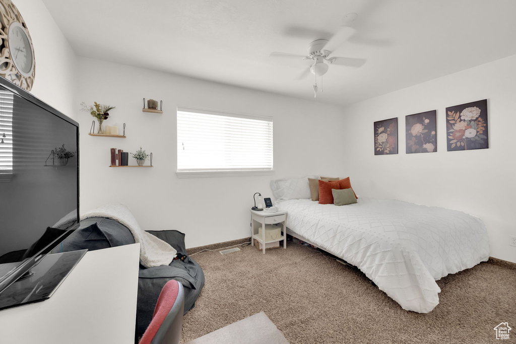 Bedroom featuring carpet and a ceiling fan