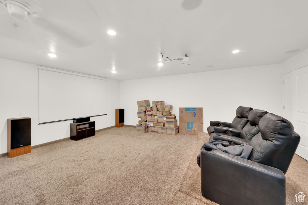 Carpeted cinema room featuring recessed lighting and baseboards