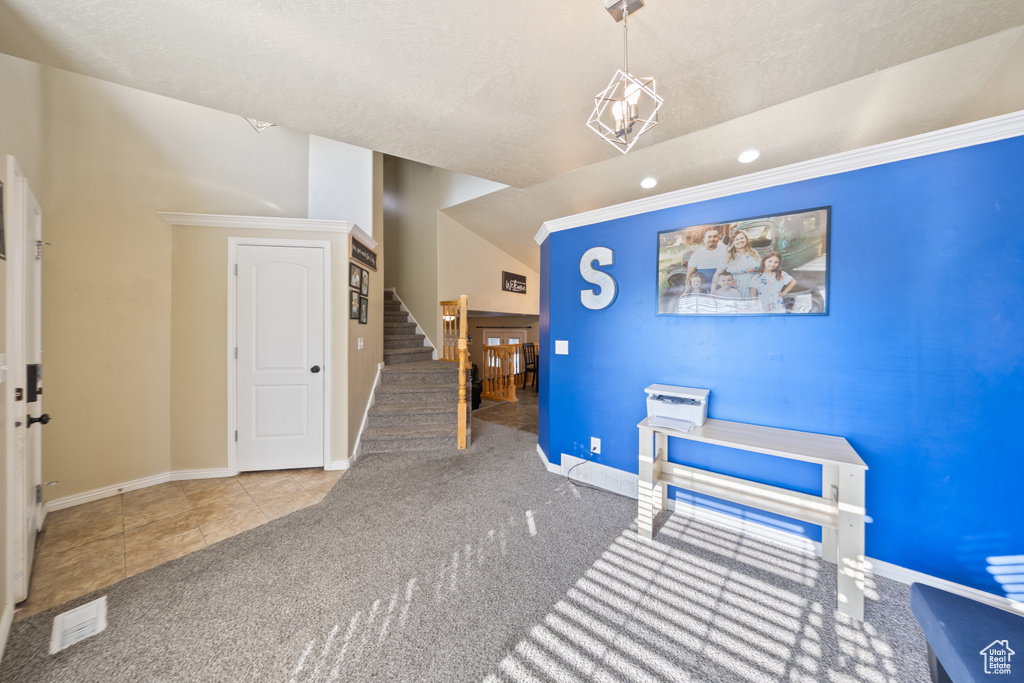 Carpeted dining area featuring stairway, tile patterned flooring, recessed lighting, and ornamental molding