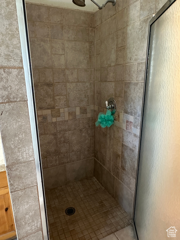 Full bath with a shower stall
