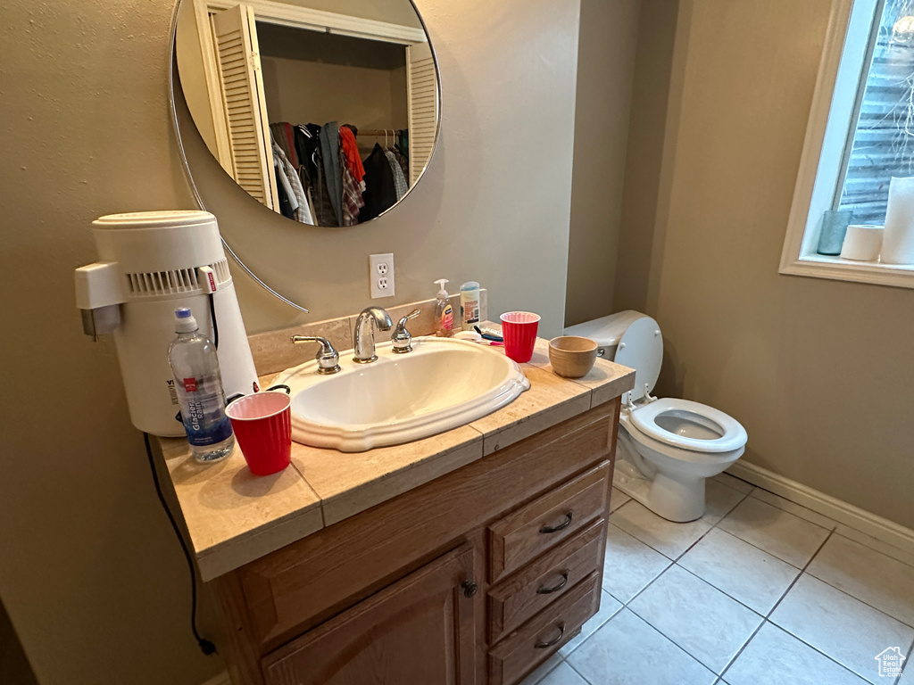 Bathroom featuring vanity and tile patterned flooring