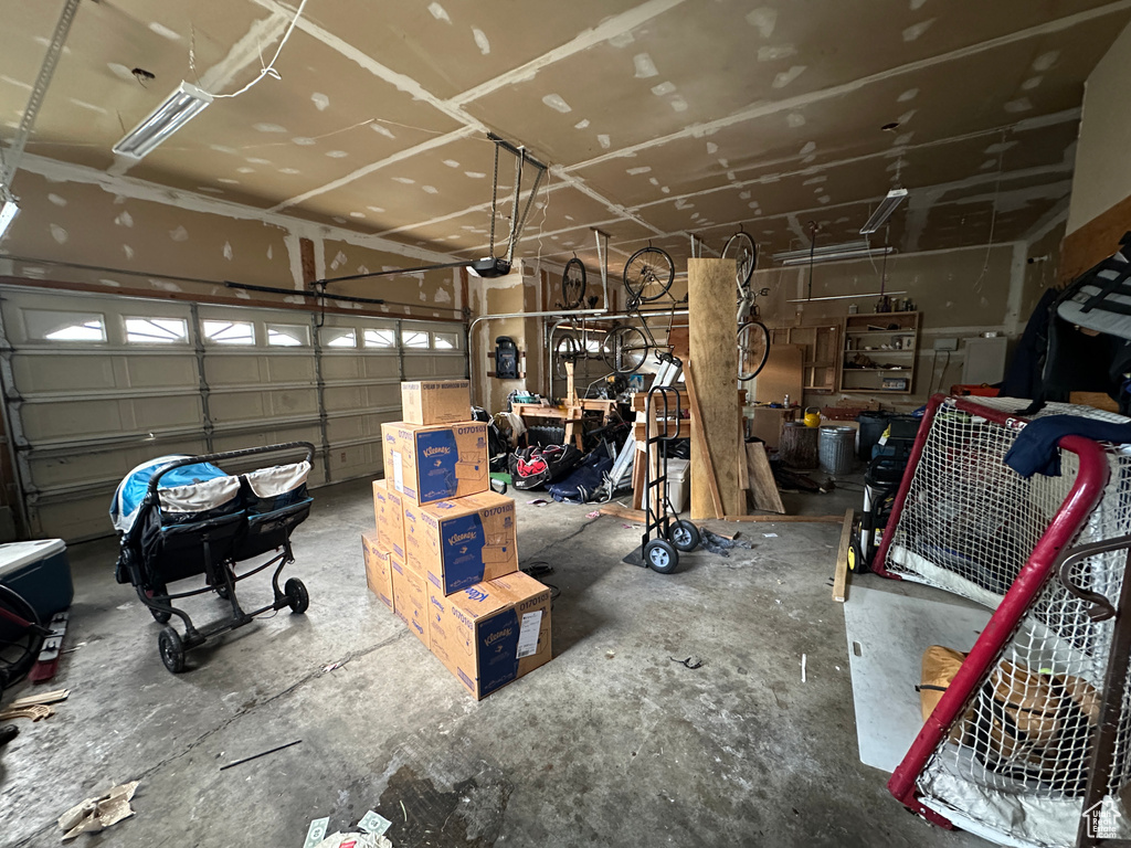 Garage featuring a garage door opener