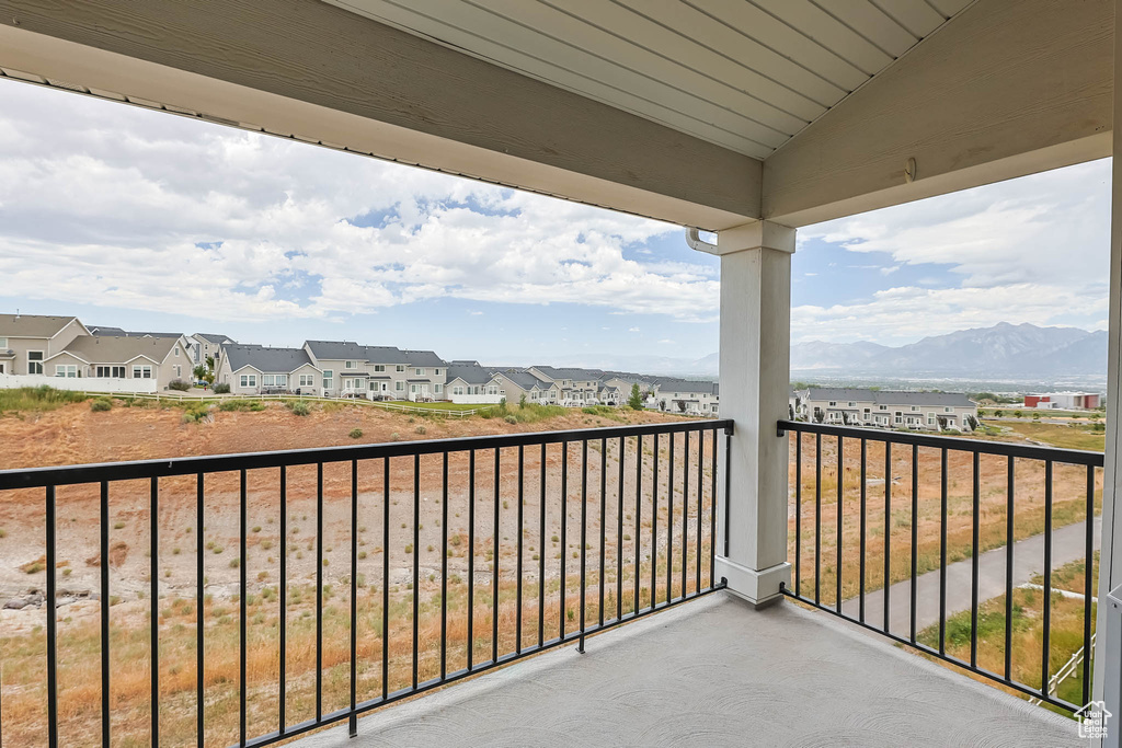 Balcony with a residential view and a mountain view