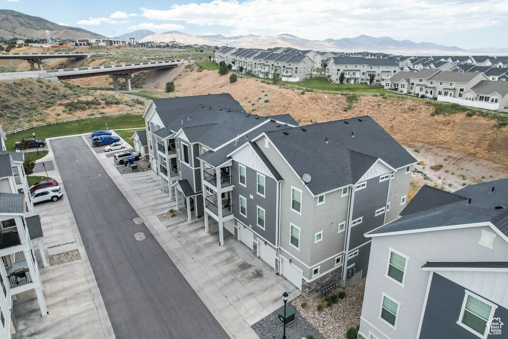 Aerial perspective of suburban area with a mountain backdrop
