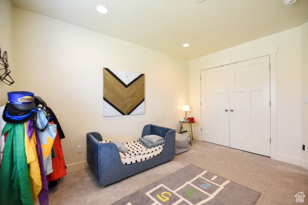 Living area featuring carpet floors and recessed lighting