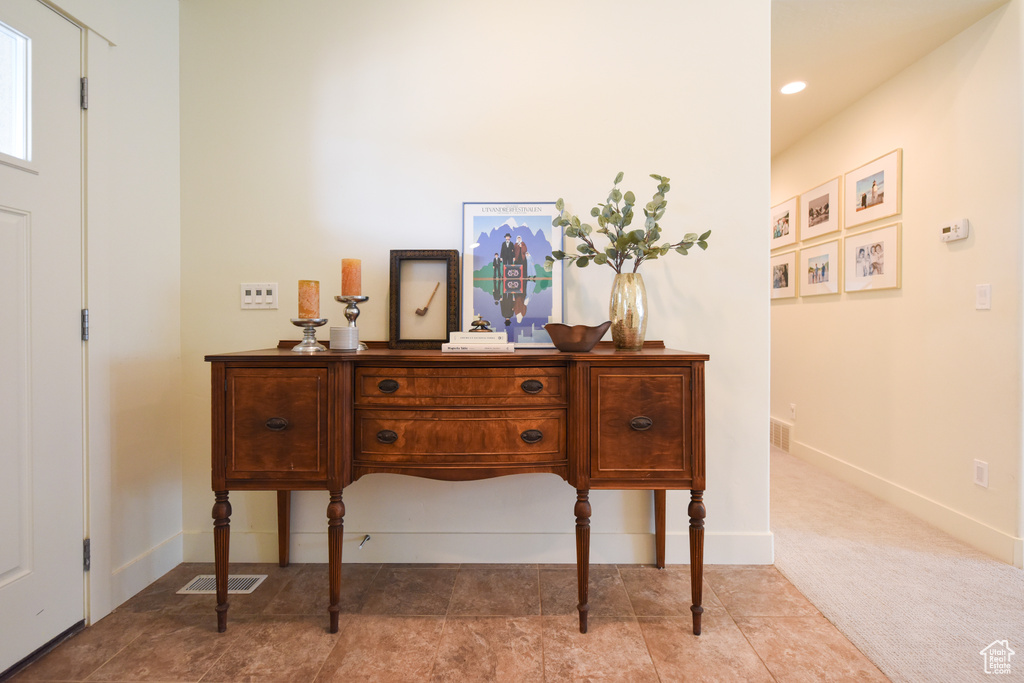 Detailed view of baseboards and recessed lighting