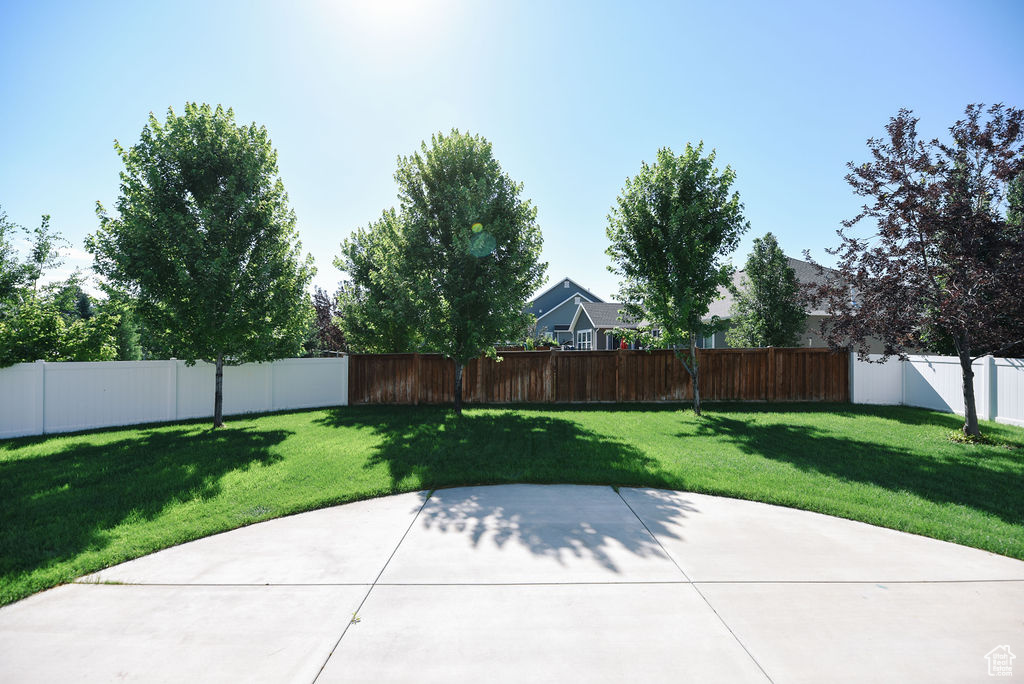 Fenced backyard featuring a patio area