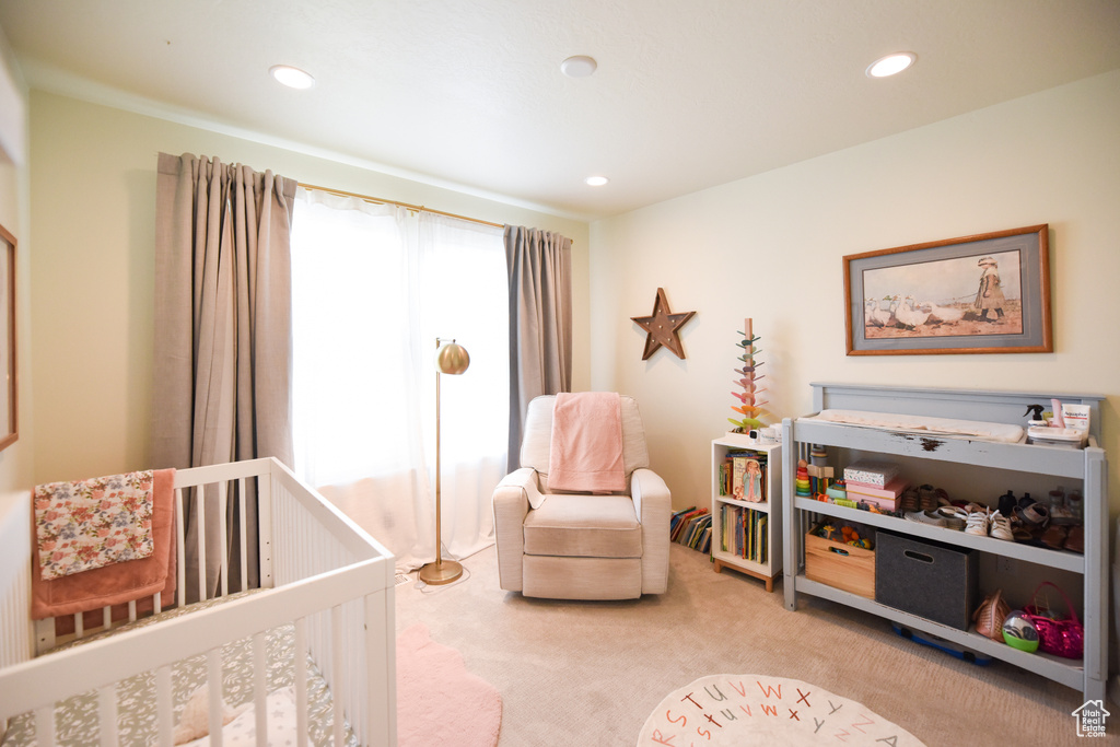 Bedroom featuring a nursery area, carpet, and recessed lighting