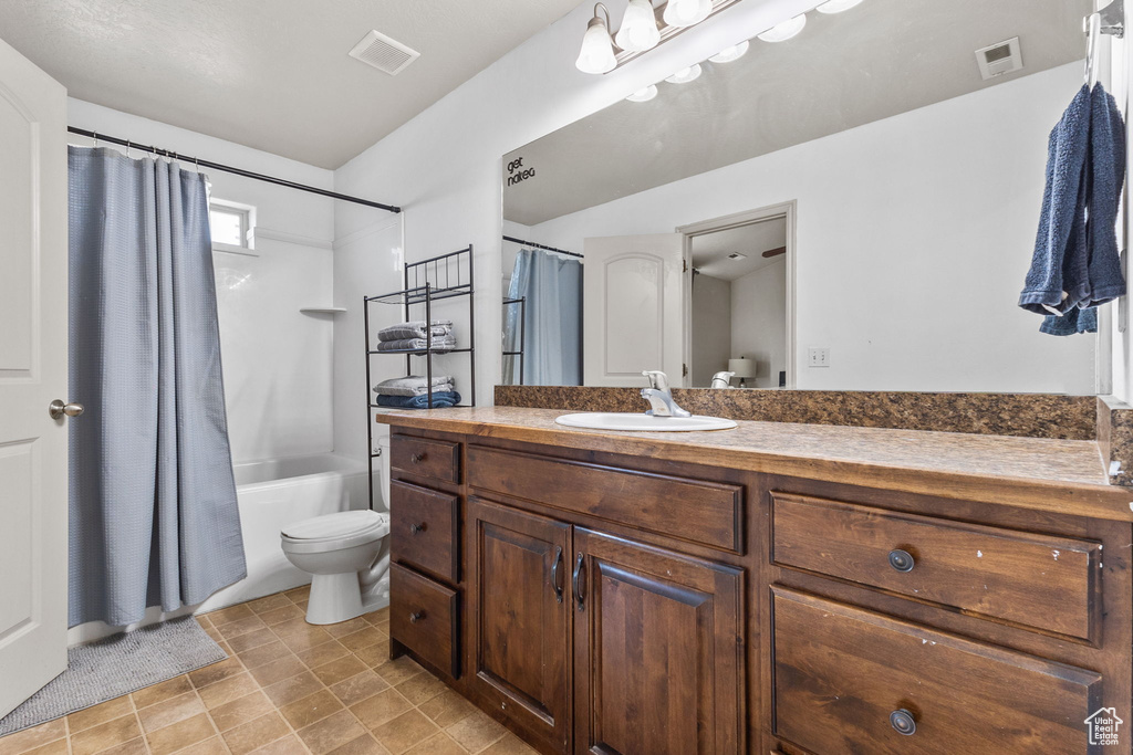 Full bathroom with vanity and shower / bathtub combination with curtain