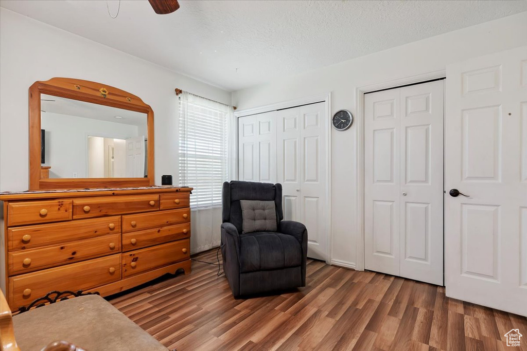 Living area with wood finished floors and a textured ceiling