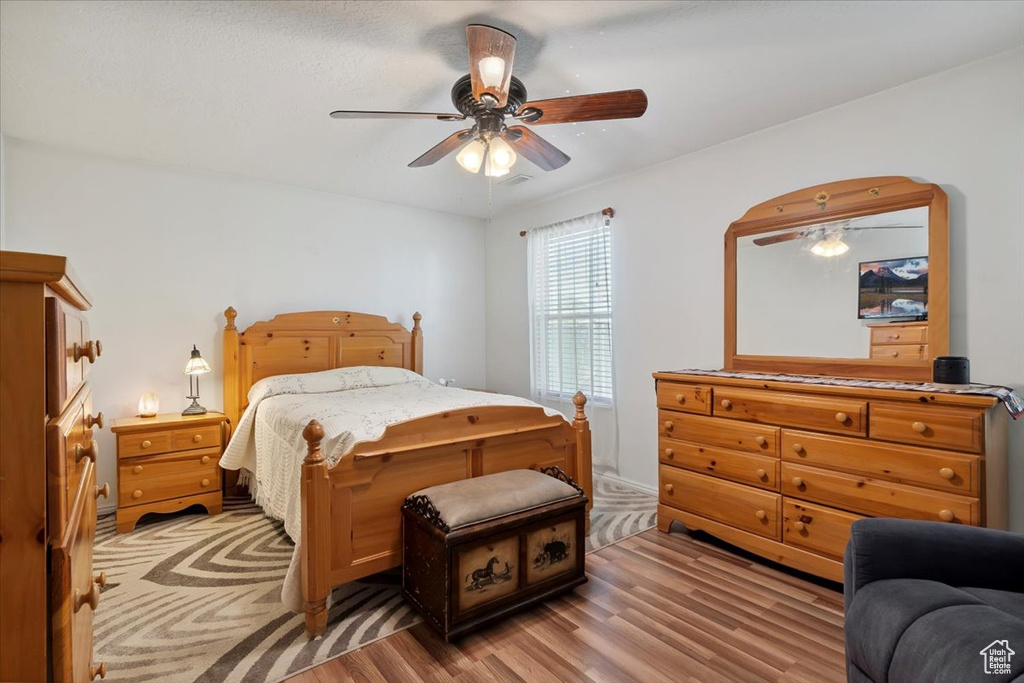 Bedroom featuring light wood finished floors and a ceiling fan