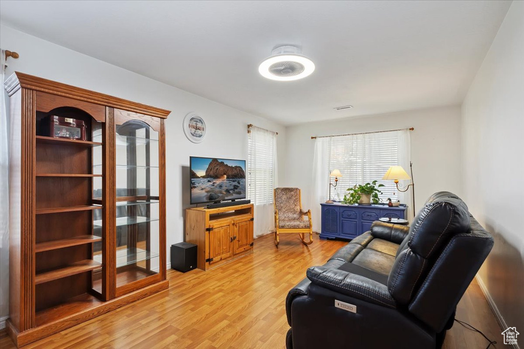 Living room with light wood-type flooring