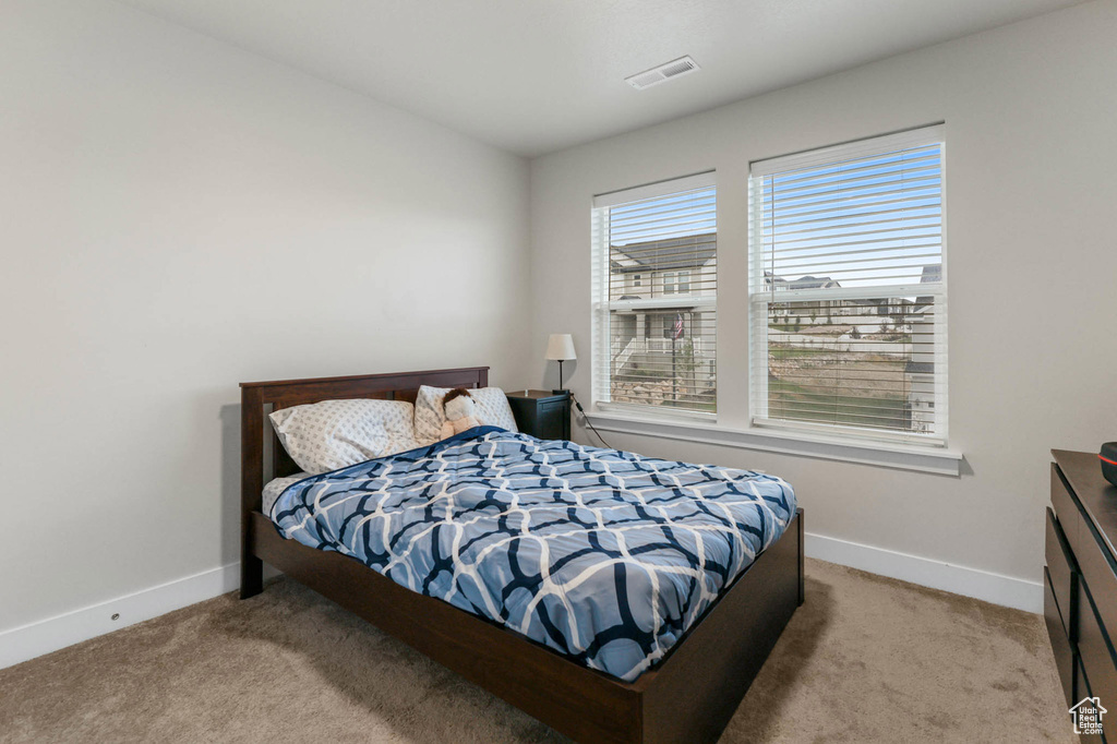 Bedroom featuring carpet floors