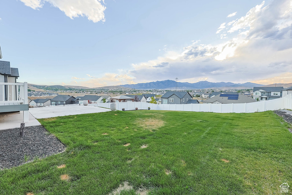 View of yard with a patio area, a mountain view, and a residential view